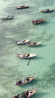 Vertical Video Boats in the Ocean Near the Coast of Zanzibar Tanzania