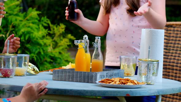 Childrens  party.Children open  fruit drinks  in a summer sunny garden. summer drink.