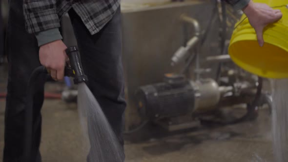 Brewery Worker Running Water Rinsing Equipment