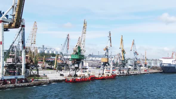 Boats And Cranes In Front Of The Port