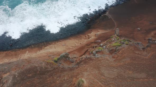 Man Walking Down on Road to Ocean at Capelinhos Volcano Faial Island Azores