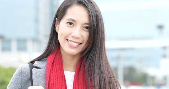 Woman smile to camera at outdoor