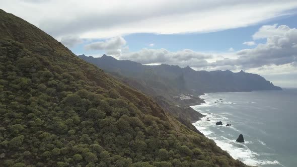 Awesome Beautiful AERIAL View of a Car on a Dirt Mountain Road Over the Atlantic Ocean on Tenerife