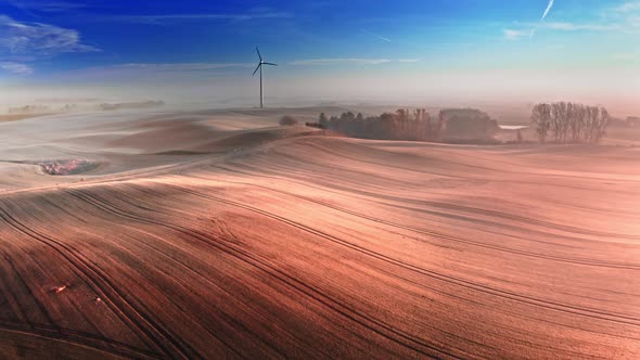 Wind turbine on field. Alternative energy. Aerial view of nature