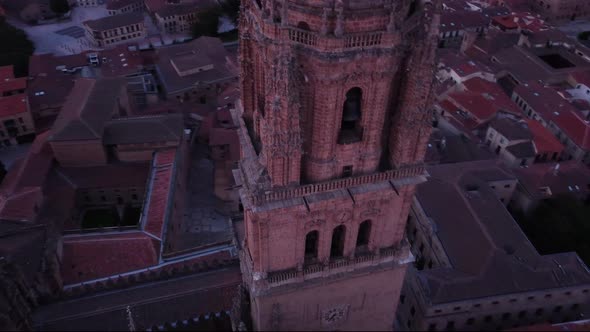 Close up aerial view of the tower of Salamanca cathedral and cityscape in the early morning light