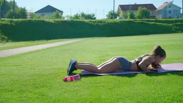Woman Practicing Push Ups From Knees Outdoors