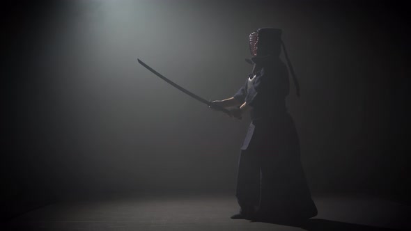 Kendo Instructor Practicing Martial Art with the Katana Sword.