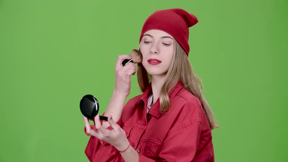 Girl Is Applying Makeup with a Brush, Green Screen, Slow Motion