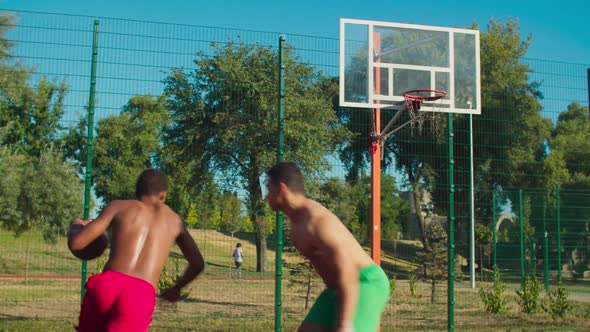 Shirtless Fit Sportsmen Playing Streetball Outdoor