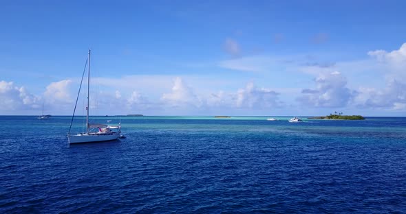 Tropical aerial copy space shot of a white sandy paradise beach and blue water background in best qu