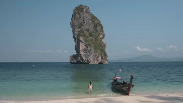 Asian Woman Mid Age on Tropical Beach in Thailand Tourist Walking on a White Tropical Beach Railay