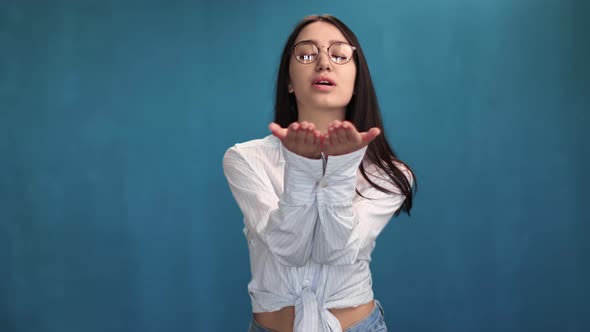 Pleasant Smiling Brunette Girl Making Air Kiss Posing Isolated