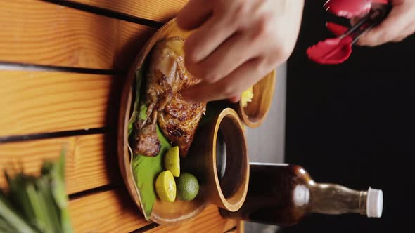 Portrait Shot of Serving Mouthwatering Special Chicken Inasal on Traditional Plate with Sauce and Sa