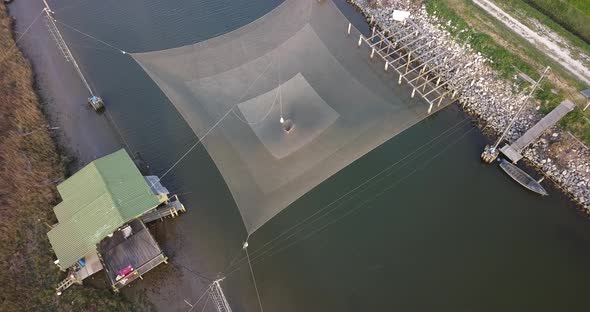 Aerial View of a Fishing Net Above the River