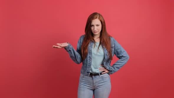 Woman Isolated on Red Background Unhappy for Not Understand Something