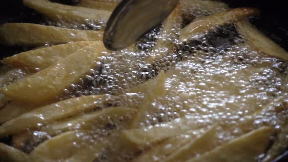 Potato Boiling Fried in Hot Oil in Pan