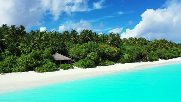 Daytime aerial copy space shot of a summer white paradise sand beach and aqua blue water background 