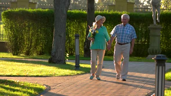 Senior Couple Walks in Slow-mo