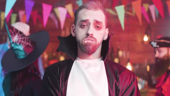 Slow Motion Portrait of a Young Man Dressed in Vampire Costume