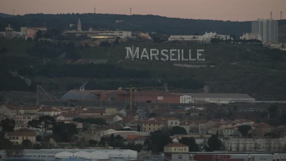 Marseille Cityscape and Sign on Green Hills, France