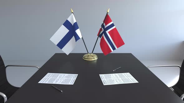 Flags of Finland and Norway on the Table