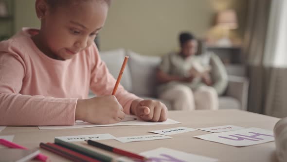 African-American Girl Studying at Home