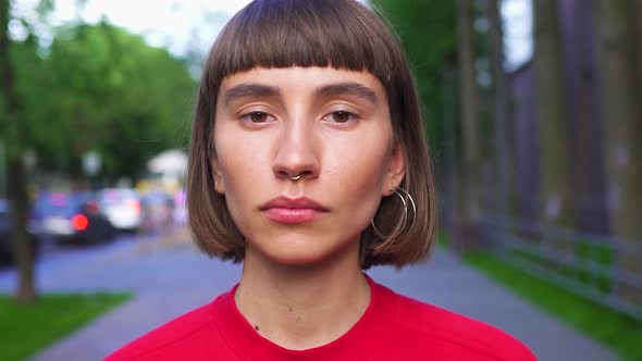 Portrait of Beautiful Millenial Girl in Red Shirt on the Street