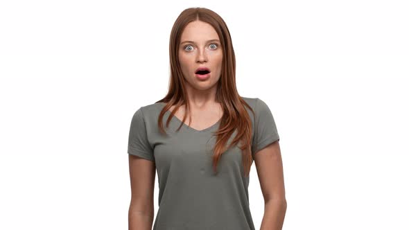 Portrait of Young Ginger Woman 20s Screaming in Shock or Outrage Isolated Over White Background