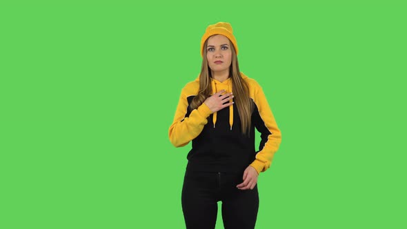 Modern Girl in Yellow Hat Is Feeling Bad, Her Stomach Hurts, Feeling Nausea. Green Screen