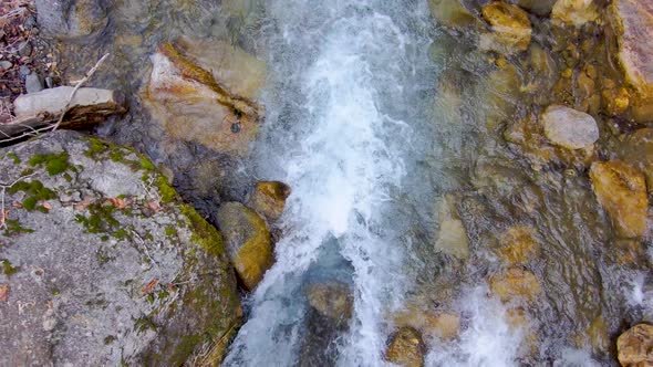 Watching the river water rush by then flying straight up to catch a bird's eye view