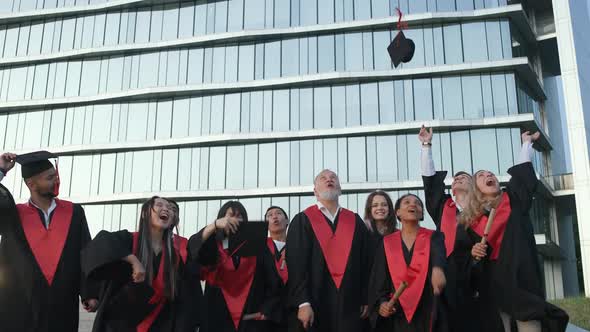 High University Graduates Rejoice at the End of Their Studies People of Different Ages and Races in