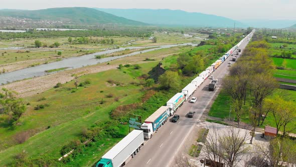 Aerial View Line Of Lorries Standing Stuck On Highway Way To Russia From Georgia