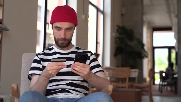 Young man shopping online