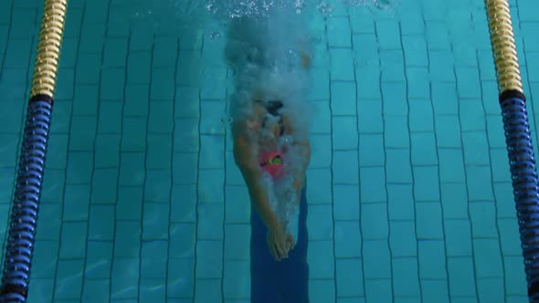 Swimmer training in a swimming pool