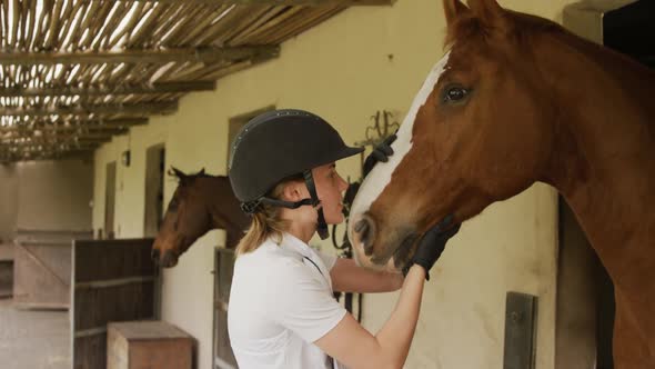 Caucasian woman with her horse