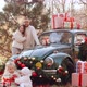 Family at the Car in Christmas Decorations - VideoHive Item for Sale