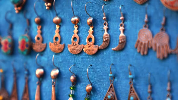 Handmade Antique Colored Jewellery Hanging on Fabric for Sale