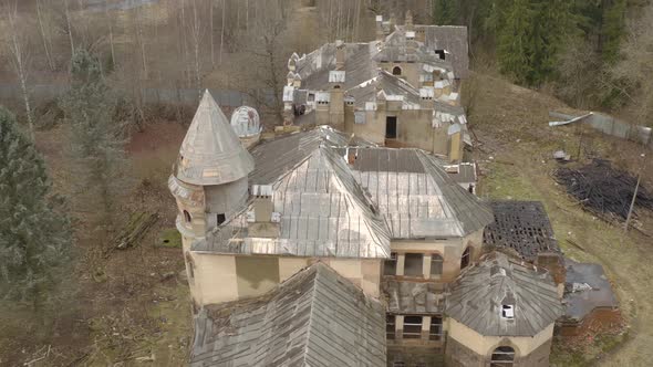 top view on collapsing building located in forest