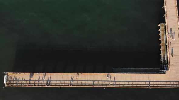 Top View Tourists Walking On Pier In Lithuania