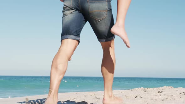 Couple in love enjoying free time on the beach together