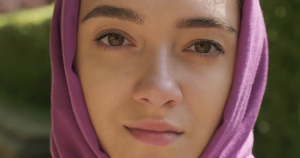 Beautiful Young Woman Looking at Camera, Wearing Traditional Headscarf. Attractive Female in Hijab