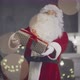 Santa Claus Giving you a Present on Christmas Eve - VideoHive Item for Sale