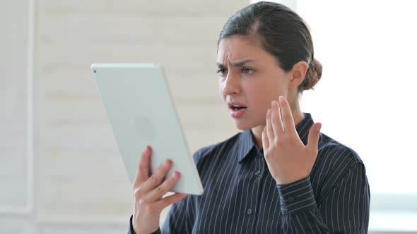 Young Indian Woman Having Loss on Tablet