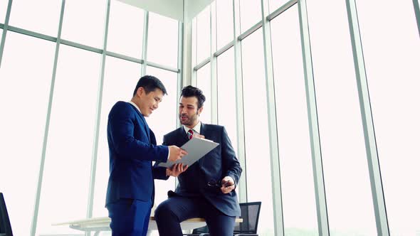 Business People Handshake with Friend at Office