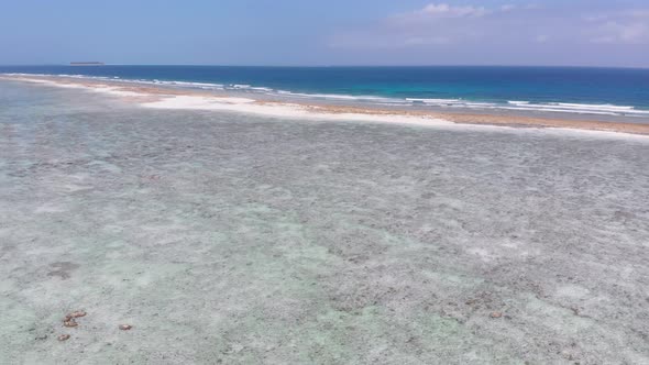 Ocean Coastline and Barrier Reef at Low Tide Zanzibar Matemwe Aerial View