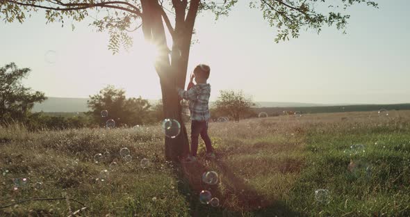 A Three Years Boy at Nature Playing with a Big