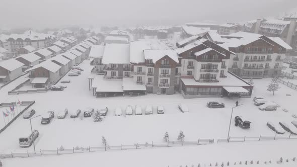 Flying over mountain resort Crystal in Bakuriani. Snowy winter day. Georgia