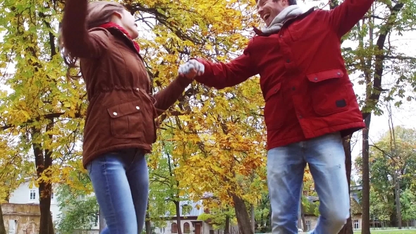 Happy Young Couple Having Fun In Autumn Park 35