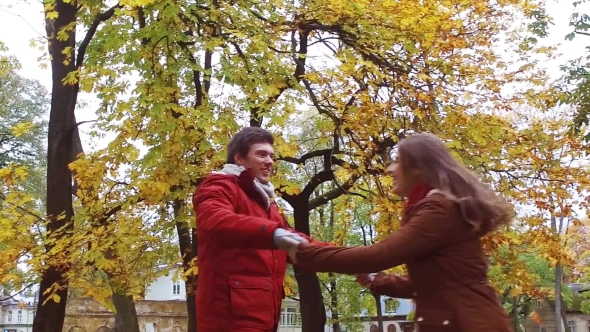 Happy Young Couple Having Fun In Autumn Park 36