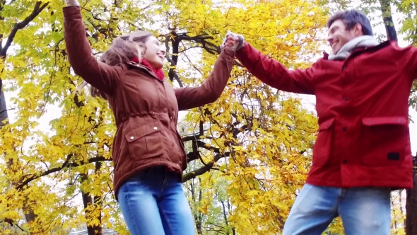 Happy Young Couple Having Fun In Autumn Park 38